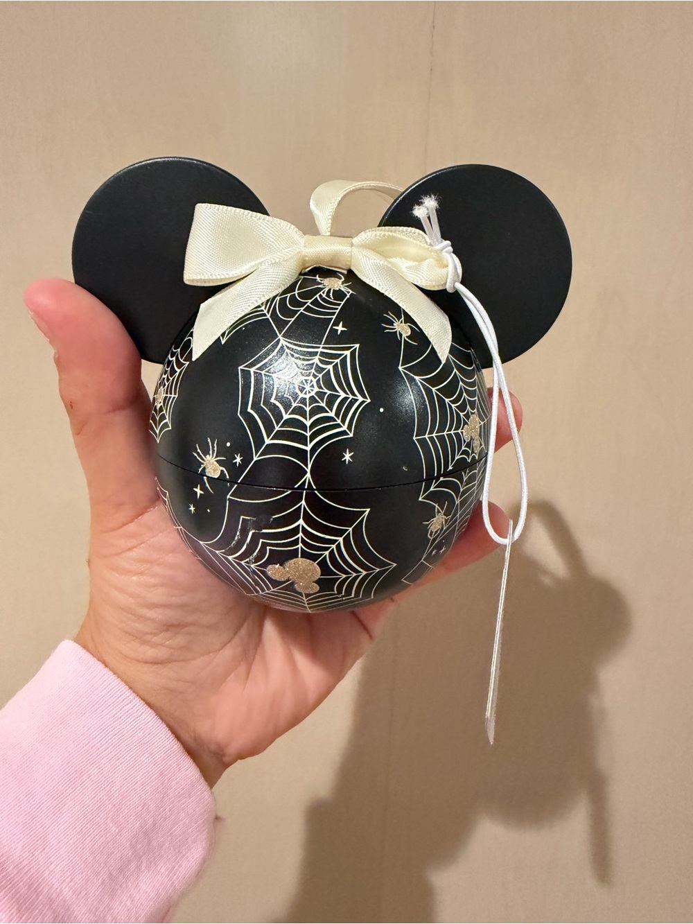 Disney Spiderweb Mickey Ear Ornament with silver necklace and earrings inside